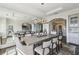 Dining room featuring a large mirror wall, stylish chairs, and modern lighting at 2700 Paces Ferry Se Rd # 302, Atlanta, GA 30339