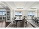 Bright dining room featuring a modern chandelier, large windows, and stylish furnishings at 2700 Paces Ferry Se Rd # 302, Atlanta, GA 30339