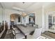 Light-filled dining room with seating for eight and an open layout to the kitchen and living areas at 2700 Paces Ferry Se Rd # 302, Atlanta, GA 30339