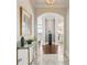 Elegant foyer showcasing marble floors, arched doorways, and views of the living area beyond at 2700 Paces Ferry Se Rd # 302, Atlanta, GA 30339