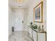 Welcoming foyer boasts marble floors, an elegant console table, and sophisticated decor at 2700 Paces Ferry Se Rd # 302, Atlanta, GA 30339