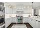 Spacious kitchen with white cabinetry, stainless steel appliances, and elegant marble countertops at 2700 Paces Ferry Se Rd # 302, Atlanta, GA 30339