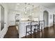 Bright kitchen with white cabinetry, bar seating, and modern appliances at 2700 Paces Ferry Se Rd # 302, Atlanta, GA 30339