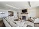 Spacious living room with a stone fireplace, and city views at 2700 Paces Ferry Se Rd # 302, Atlanta, GA 30339