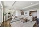 Open living room with views to the dining area, large area rug, and stylish furniture at 2700 Paces Ferry Se Rd # 302, Atlanta, GA 30339