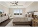 Bright and airy bedroom with a tray ceiling, ceiling fan, and a scenic view from the window at 2700 Paces Ferry Se Rd # 302, Atlanta, GA 30339