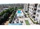 Aerial view of a luxury building's amenity deck, featuring a pool and lounge area at 2700 Paces Ferry Se Rd # 302, Atlanta, GA 30339