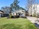 Lovely two-story home showcasing a meticulously maintained lawn and covered parking at 2734 Skyland Ne Dr, Brookhaven, GA 30319