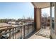 Balcony view overlooking city buildings and tree tops at 3820 Roswell Ne Rd # 317, Atlanta, GA 30342