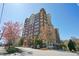 Beautiful multi-story building with brick facade, multiple balconies, and mature trees at 3820 Roswell Ne Rd # 317, Atlanta, GA 30342