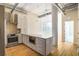 Bright open kitchen with modern cabinets, stainless steel appliances, and hardwood floors at 3820 Roswell Ne Rd # 317, Atlanta, GA 30342