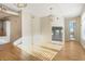 Spacious living area with modern lighting fixtures, hardwood floors, and open-concept design at 3820 Roswell Ne Rd # 317, Atlanta, GA 30342
