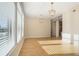 Spacious living room with hardwood floors, large windows, and contemporary lighting at 3820 Roswell Ne Rd # 317, Atlanta, GA 30342