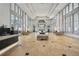 Spacious, well lit lobby with a patterned tile floor, grand windows, and lounge seating at 3820 Roswell Ne Rd # 317, Atlanta, GA 30342