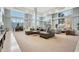 A stylish community lounge area with a large sectional sofa and ample seating by bright, natural light from the windows at 3820 Roswell Ne Rd # 317, Atlanta, GA 30342