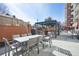 Outdoor dining area with pergola, BBQ grill, and ample seating for entertaining at 3820 Roswell Ne Rd # 317, Atlanta, GA 30342