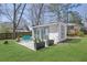 Backyard features a patio with outdoor seating and a small cottage or storage space at 965 Carr Nw St, Atlanta, GA 30318