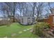 Landscaped backyard featuring a modern accessory dwelling unit (ADU) and a unique playhouse at 965 Carr Nw St, Atlanta, GA 30318