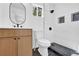 Modern bathroom features an updated vanity, toilet, and walk-in shower with mosaic details at 965 Carr Nw St, Atlanta, GA 30318