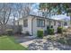 Charming painted brick home with gray trim, green lawn, and manicured landscaping at 965 Carr Nw St, Atlanta, GA 30318