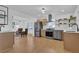 Modern kitchen with stainless steel appliances and open shelving, perfect for cooking and entertaining at 965 Carr Nw St, Atlanta, GA 30318