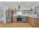Stylish kitchen with light wood cabinetry, stainless steel appliances, and a modern range hood at 965 Carr Nw St, Atlanta, GA 30318
