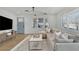 Bright living room featuring modern light fixture, hardwood floors, and a comfortable sofa at 965 Carr Nw St, Atlanta, GA 30318