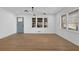 Sun-drenched living room boasts hardwood floors and fresh, neutral paint at 965 Carr Nw St, Atlanta, GA 30318