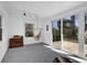 Bright sunroom features a comfortable hanging chair and sliding glass doors to the backyard at 965 Carr Nw St, Atlanta, GA 30318