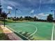 Community basketball court and sand volleyball court surrounded by landscaping and trees at 271 Balaban Cir, Woodstock, GA 30188