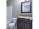 Bathroom features a tub, toilet, granite counter and dark wood cabinet at 271 Balaban Cir, Woodstock, GA 30188