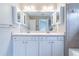 Bathroom features a double vanity and a large mirror at 271 Balaban Cir, Woodstock, GA 30188