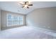 Spacious bedroom is well-lit by three large windows at 271 Balaban Cir, Woodstock, GA 30188