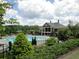 View of the community pool and clubhouse; the pool has lap lanes and a slide at 271 Balaban Cir, Woodstock, GA 30188