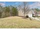 Traditional two-story home with a two-car garage, manicured lawn, and lush landscaping on a large lot at 271 Balaban Cir, Woodstock, GA 30188