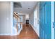 Inviting foyer with hardwood floors, a staircase, and a view into the adjacent living area with a fireplace at 271 Balaban Cir, Woodstock, GA 30188