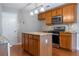 Kitchen island with cabinets and stainless steel appliances at 271 Balaban Cir, Woodstock, GA 30188