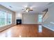 Bright living room featuring hardwood floors, fireplace, and natural light at 271 Balaban Cir, Woodstock, GA 30188