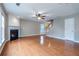 Comfortable living room showcasing hardwood floors, a classic fireplace, and an inviting staircase at 271 Balaban Cir, Woodstock, GA 30188