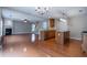 Open floorplan showcasing kitchen and living room with hardwood floors at 271 Balaban Cir, Woodstock, GA 30188