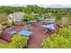 Aerial view of community playground with slides and playground equipment, as well as picnic tables and shade at 271 Balaban Cir, Woodstock, GA 30188