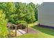 Trail entrance at end of a house; wooden ramp gives access to the trail at 271 Balaban Cir, Woodstock, GA 30188