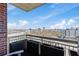 Balcony view with planters and chairs overlooking city views at 285 Centennial Olympic Park Dr # 1705, Atlanta, GA 30313