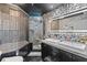 Unique bathroom featuring mosaic tiles, a glass-enclosed shower, and dual vanity sinks at 285 Centennial Olympic Park Dr # 1705, Atlanta, GA 30313