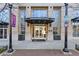 Museum Tower building entrance with brick facade, glass doors, and sidewalk planters at 285 Centennial Olympic Park Dr # 1705, Atlanta, GA 30313