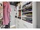 Well-organized walk-in closet featuring ample shelving and storage space for clothing and accessories at 285 Centennial Olympic Park Dr # 1705, Atlanta, GA 30313