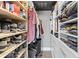 Spacious walk-in closet with custom shelving and storage solutions for shoes, clothes, and accessories at 285 Centennial Olympic Park Dr # 1705, Atlanta, GA 30313