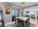 Dining area with large window and city views, offering a stylish living and dining space at 285 Centennial Olympic Park Dr # 1705, Atlanta, GA 30313