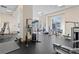 Well-equipped gym with modern exercise machines and ample workout space at 285 Centennial Olympic Park Dr # 1705, Atlanta, GA 30313