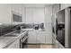 Kitchen showcasing stainless steel appliances and sleek cabinetry, creating a modern, functional space at 285 Centennial Olympic Park Dr # 1705, Atlanta, GA 30313